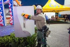 CEMC lineman Jame Crowder lights the midway during the opening ceremony of the 2016 Tennessee State Fair.